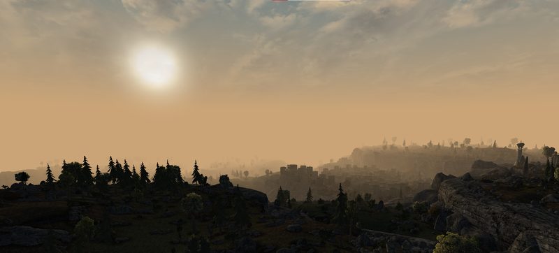 A wide valley of pine and rock under a pale sun.